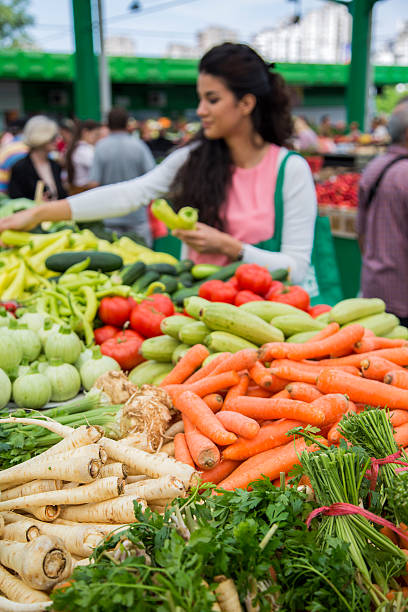 istock Young woman on the market 520468131