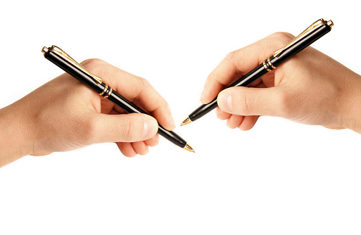left-handed and right-handed person writing on white background isolated