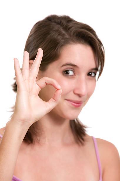 istock Hispanic young woman with OK hand sign. 520469893