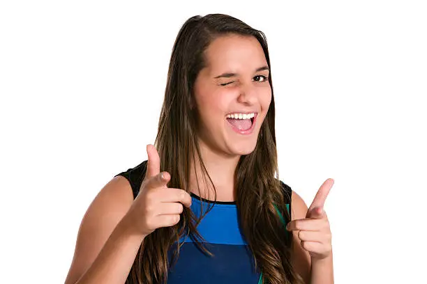 Photo of Hispanic young woman with positive expression, winking eye.