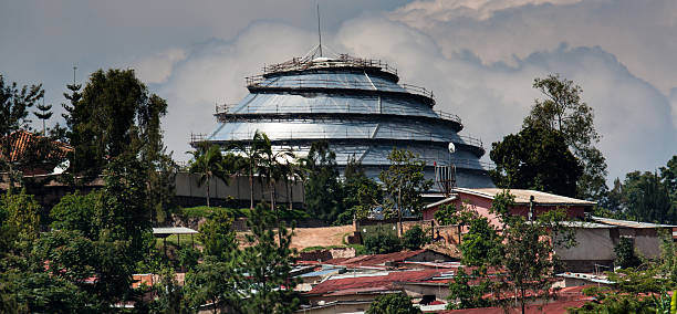 Kigali Convention Centre Kigali, Rwanda - October 18, 2014: The Kigali Convention Centre located at the KG2 roundabout along KN5 Road in Kigali rises above some nearby housing. kigali convention center stock pictures, royalty-free photos & images