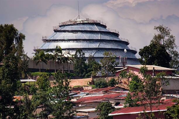 Kigali Convention Centre Kigali, Rwanda - October 18, 2014: The Kigali Convention Centre located at the KG2 roundabout along KN5 Road in Kigali rises above some nearby housing. kigali convention center stock pictures, royalty-free photos & images