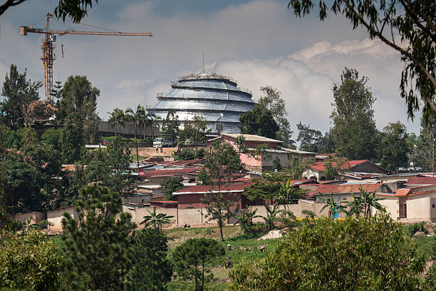 Kigali Convention Centre Kigali, Rwanda - October 18, 2014: The Kigali Convention Centre located at the KG2 roundabout along KN5 Road in Kigali is under construction and is visible above some nearby housing. kigali convention center stock pictures, royalty-free photos & images