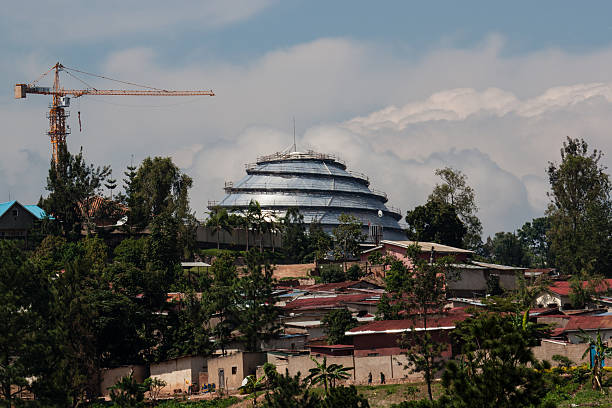 Kigali Convention Centre Kigali, Rwanda - October 18, 2014: The Kigali Convention Centre located at the KG2 roundabout along KN5 Road in Kigali is under construction and is visible above some nearby housing. kigali convention center stock pictures, royalty-free photos & images