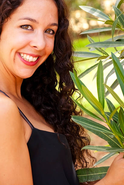 istock Beautiful woman in a park 520471253