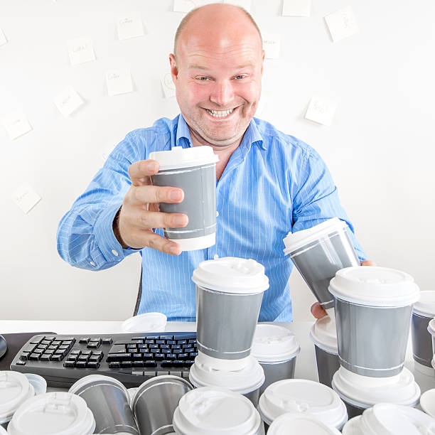 istock Business man drinks too much coffee 520471443