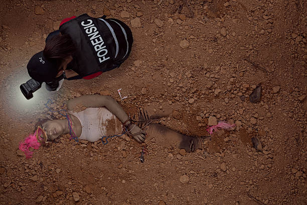 istock CSI officer photographing a female mardi gra victim 520472293