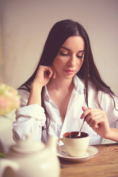 istock young brunette woman in home interior. 520473451