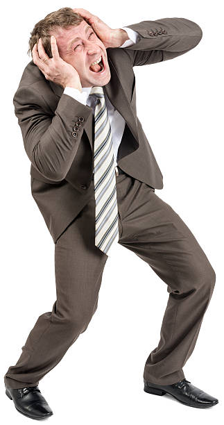 istock Screaming businessman covering his ears 520489742