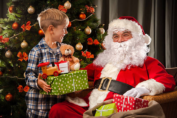 istock Santa Claus and a little boy 520490174
