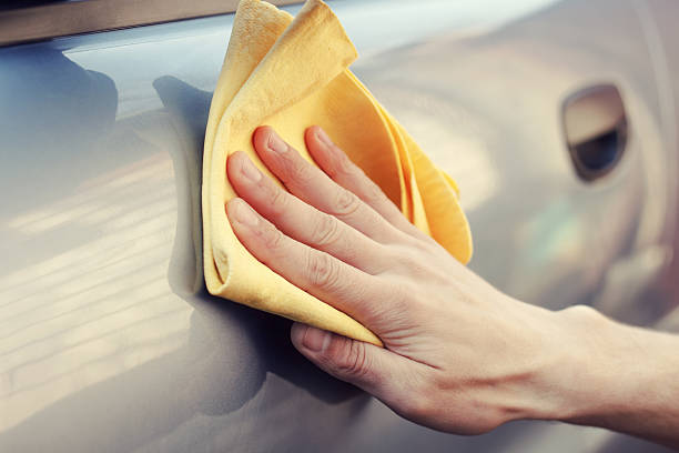istock hand with rag polish the car 520491024