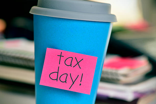 istock coffee cup with the text tax day in the office 520491776
