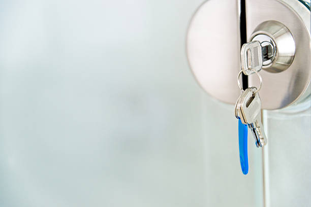 Office glass door with key in keyhole.