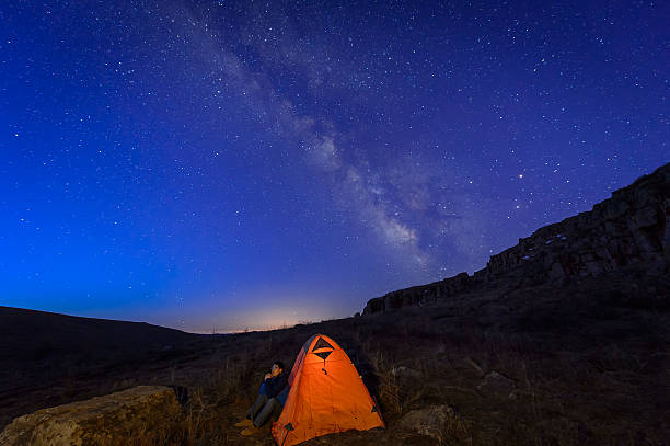istock Man Looking up at the universe and the stars 520493192