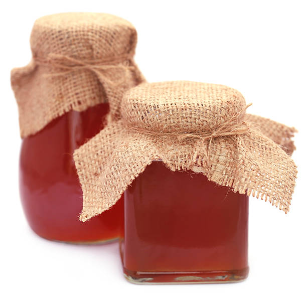 istock Honey in glass jar 520493786