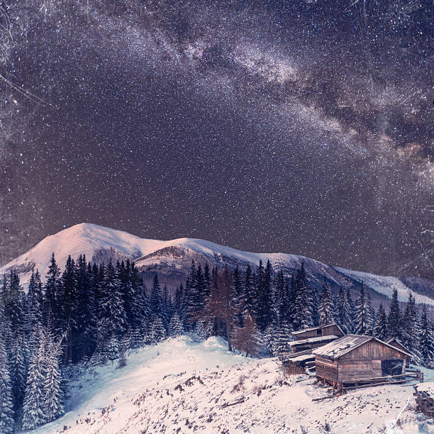 istock fantastic winter meteor shower and the snow-capped mountains. 520494116