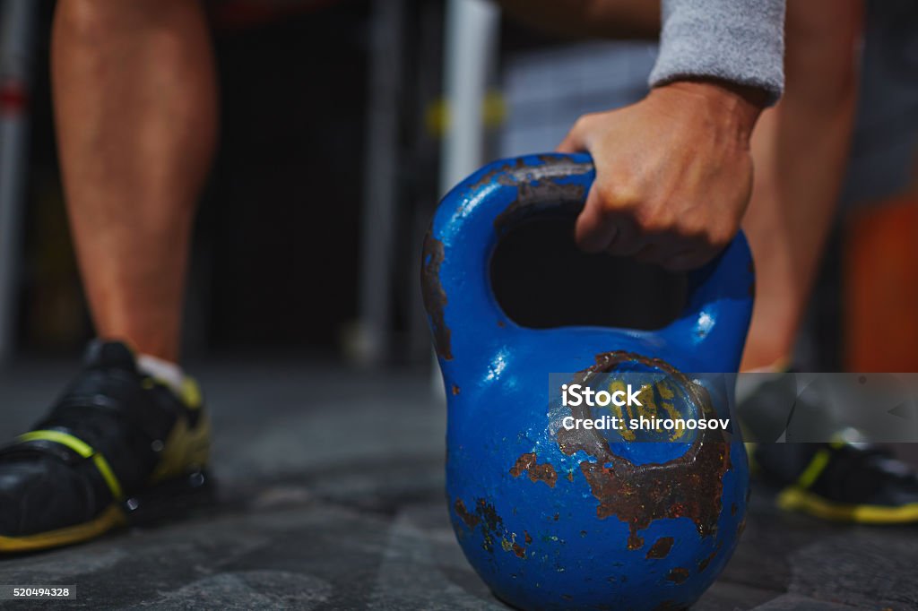 Lifting weight Female hand lifting kettle Active Lifestyle Stock Photo