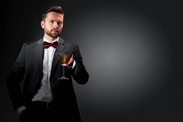 istock Young man with a cocktail glass 520494744