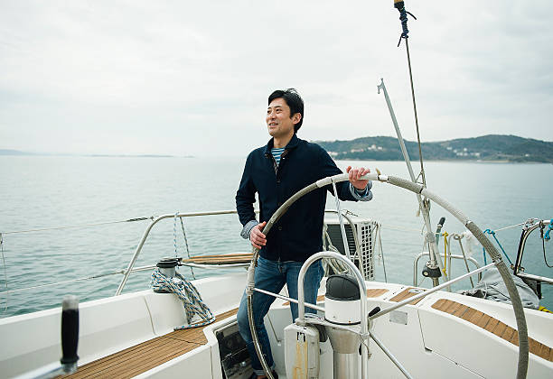 Mature man has been sailing the yacht