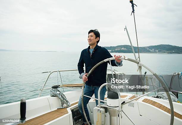 Mature Man Has Been Sailing The Yacht Stock Photo - Download Image Now - Wealth, Luxury, Lifestyles