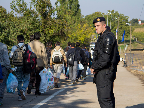 Sid, Serbia - October 17, 2015: Refugees waiting to cross the Serbo-Croatian border between the cities of Sid (Serbia) and Bapska (Croatia).