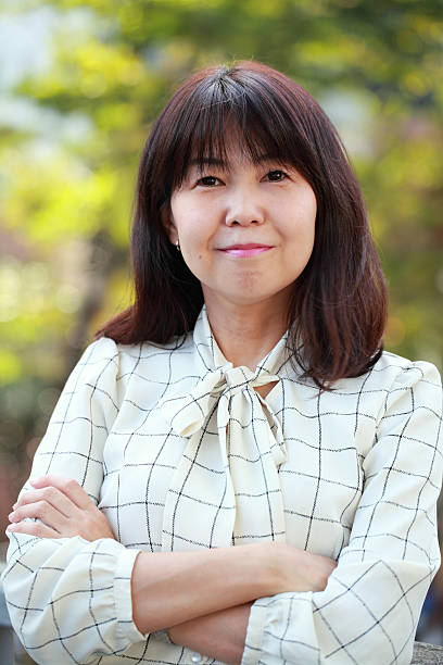 istock business woman with arm crossed 520501690