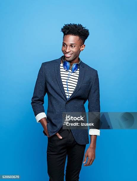 Funky Afro American Guy Against Blue Background Stock Photo - Download Image Now - Men, Fashion, African Ethnicity