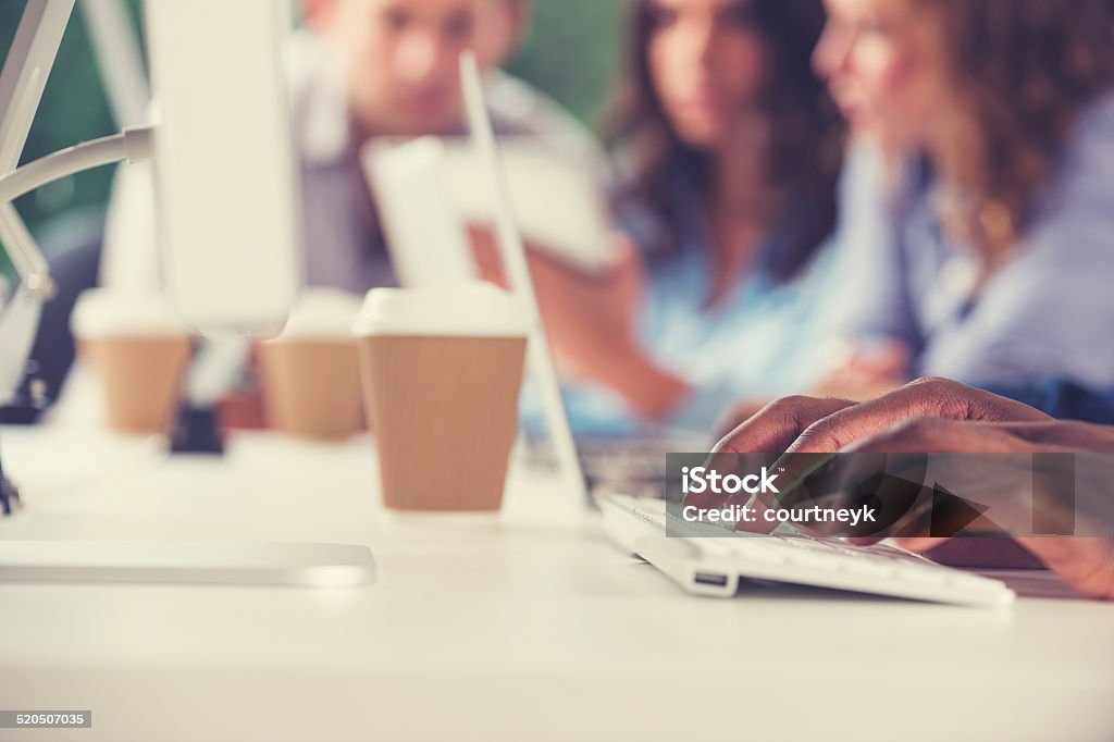 Group of people working together. Group of people working together. Close up of hands typing.   Adult Stock Photo