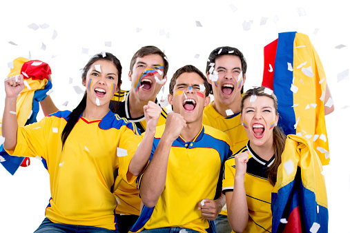Happy group of soccer fans cheering for Colombia