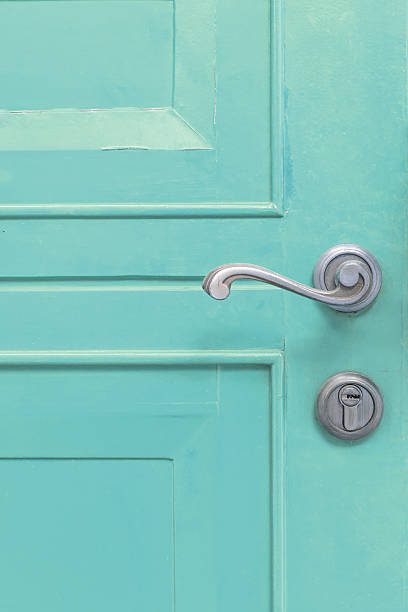 istock classic door handle on red door 520508537