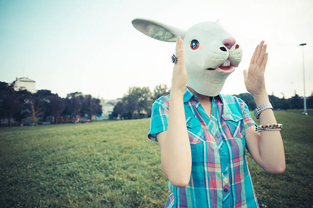 istock rabbit mask absurd beautiful young hipster woman 520509109