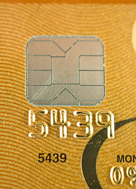 istock Credit Card Chip on a Gold Credit Card 520509959