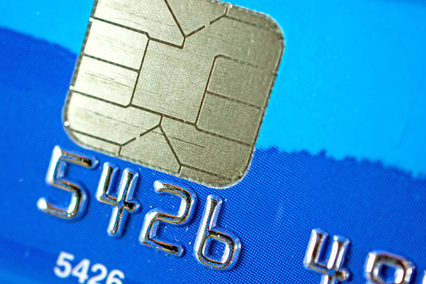 istock Credit Card Chip on a Blue Credit Card 520509971