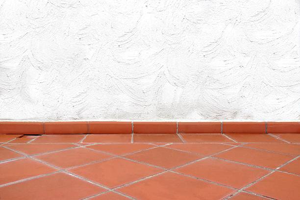 istock Terracotta Tailed Floor and White Concrete Wall 520510461
