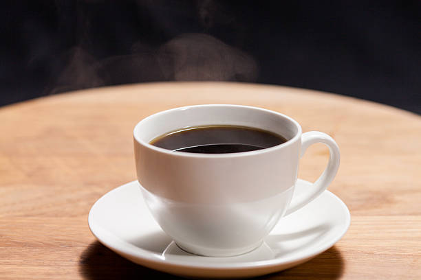 istock cup of hot coffee on a wooden table 520511175