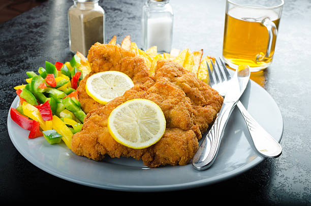 istock Schnitzel with french fries 520536671