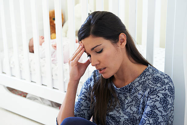 istock Frustrated Mother Suffering From Post Natal Depression 520537543