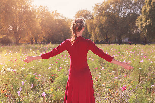 istock Young happy woman in a meadow 520538301