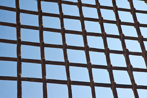 Metal grate against a blue sky - freedom concept