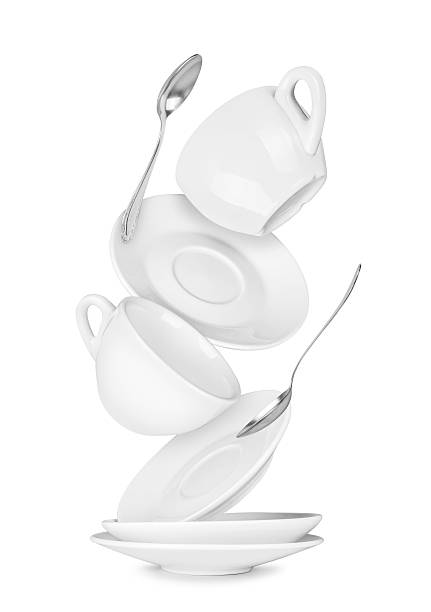 istock falling coffee cup and saucer on the isolated white background 520539495