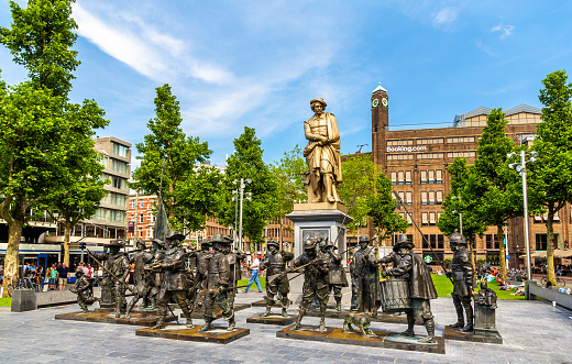 Amsterdam, Netherlands - June 9, 2014: Monument to Rembrandt and sculptures of his picture Night watch on Rembrandtplein Square.