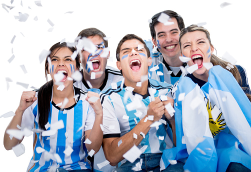 Happy group of soccer fans cheering for Argentina