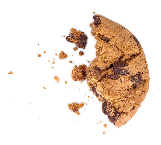 istock Chocolate chip cookie with a bite taken out and crumbs, 520543047