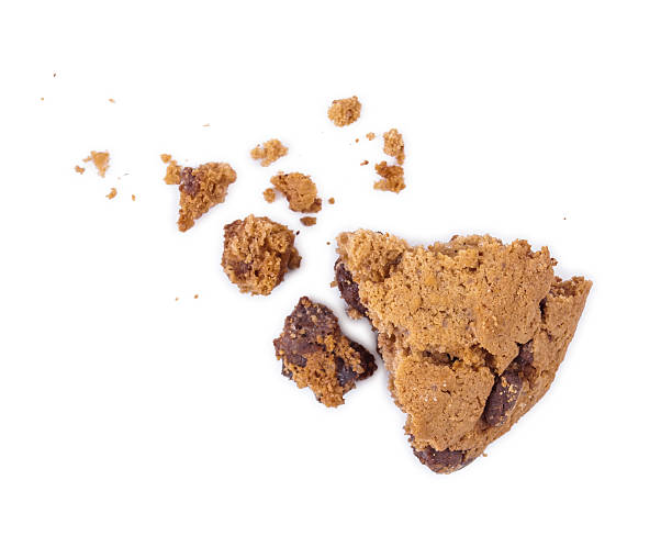 istock Chocolate chip cookie with a bite taken out and crumbs, 520543053