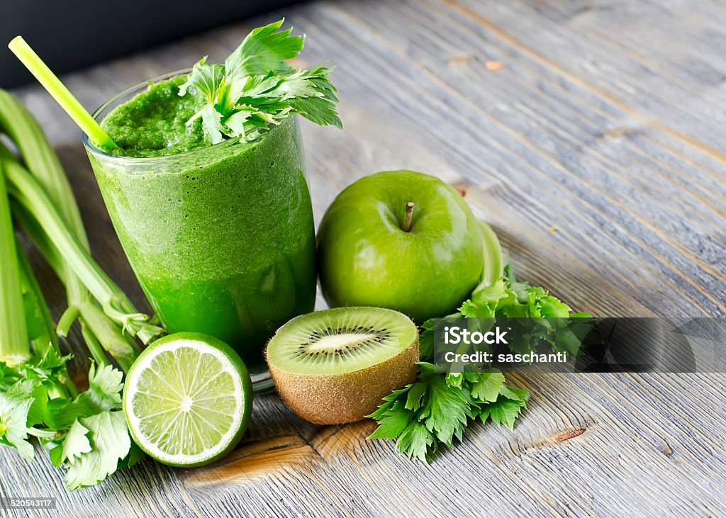 Healthy green smoothie beverage with spinach and celery Blended smoothie with ingredients selective focus copy space Celery Stock Photo