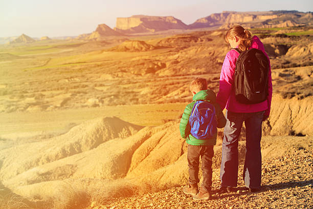 istock mother and son hiking in scenic mountains 520544082