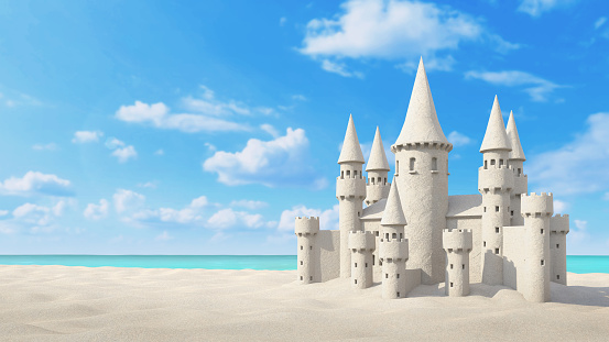 Sandcastle beach on bright blue sky background