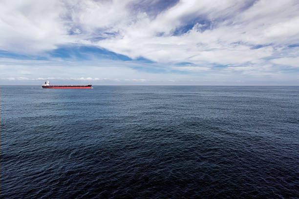 istock Cargo ship is proceeding through the sea. 520549420