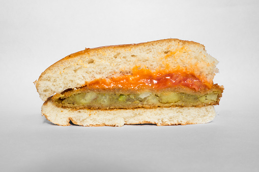 a cross section of the McAloo Tikki burger from McDonald's India