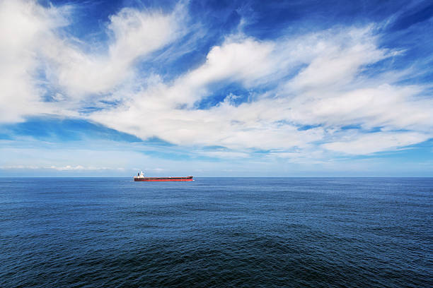 istock Cargo ship under blue sky in the sea. 520550582